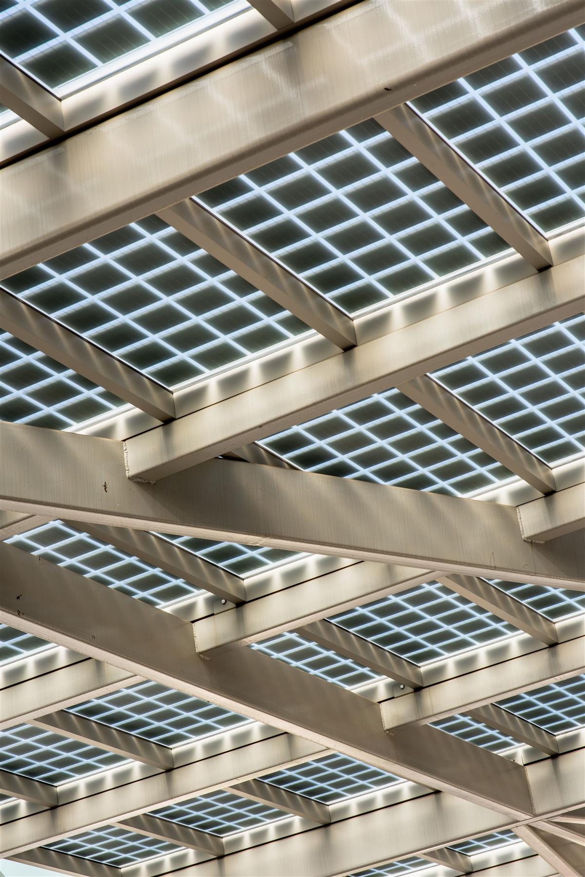 Solar canopy seen from below its supporting beams
